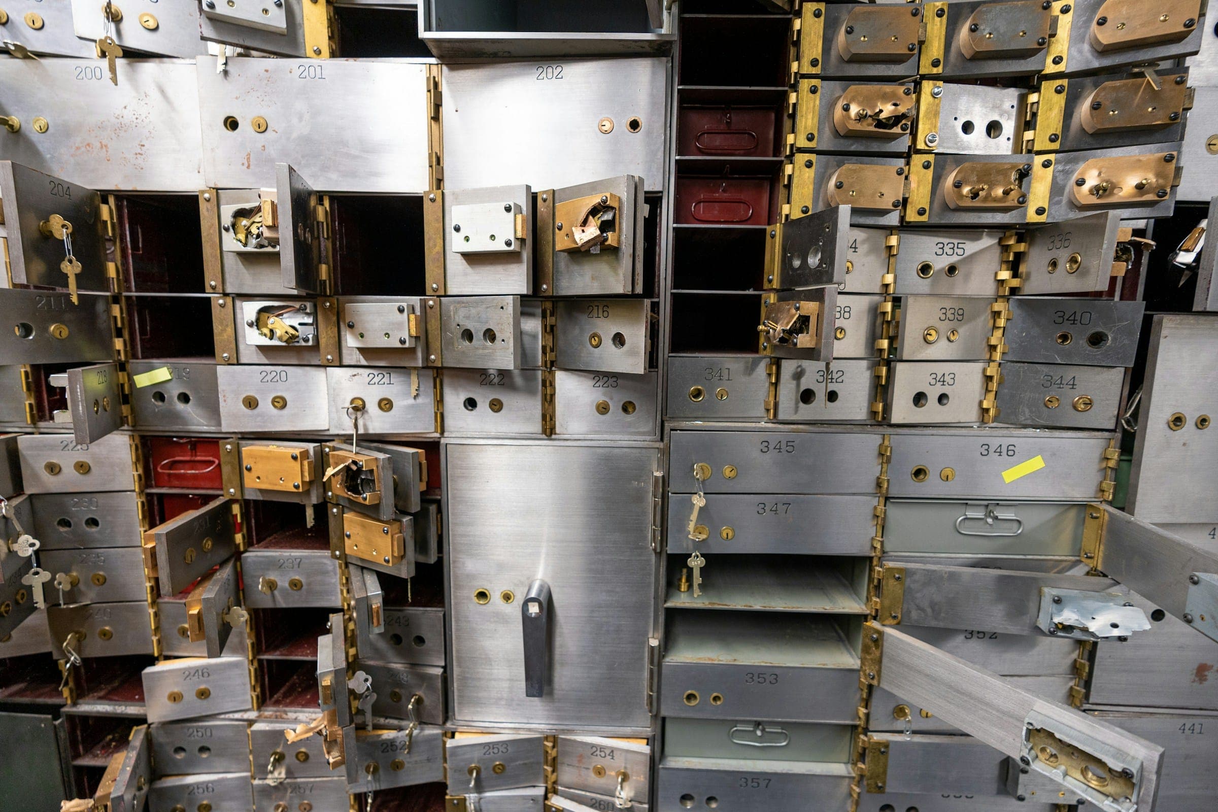 Opened safe deposit drawers inside a vault
